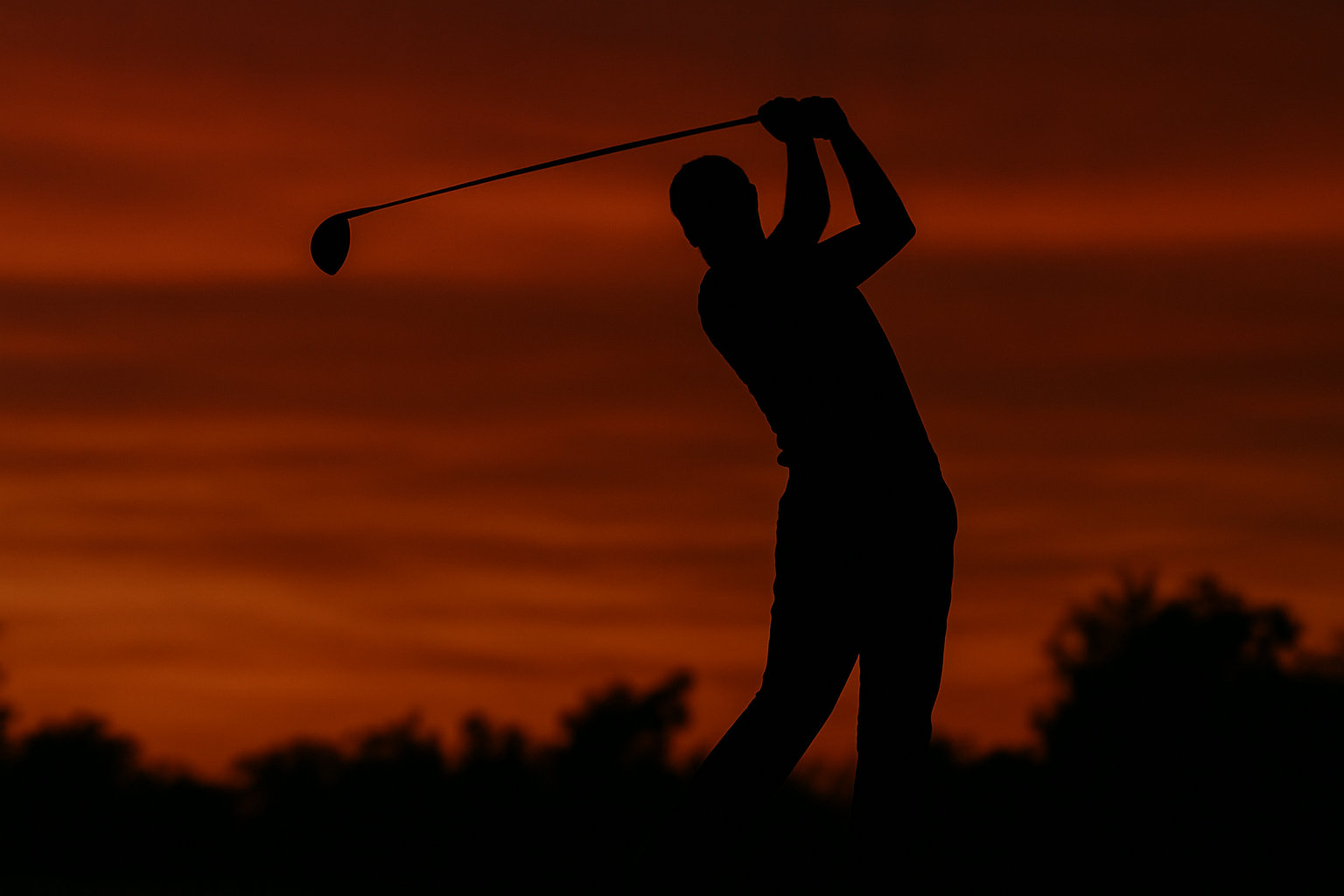 Golfers on a course at sunset preparing for a charity event.